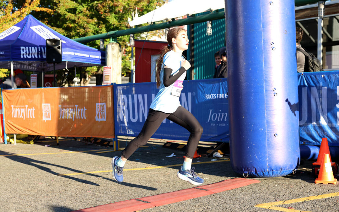 Jocelyne Chéné crossing 2026 Granville Island Turkey Trot Finish Line
